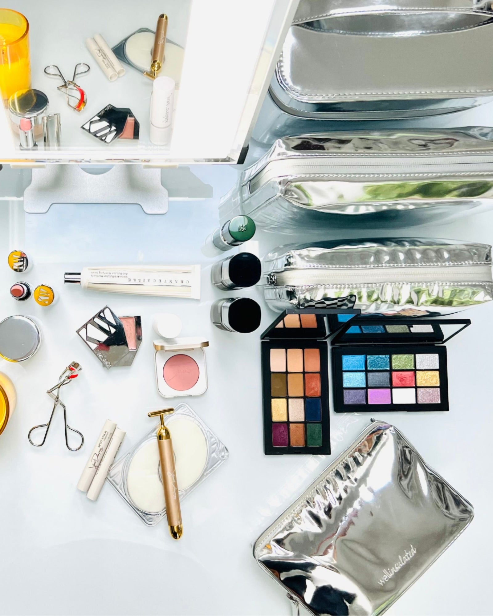 Makeup Artist setup with WELLinsulated Beauty Bags and makeup laid out