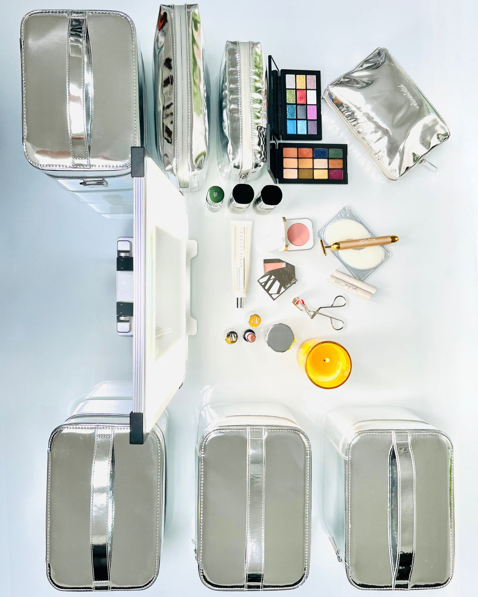 WELLinsulated Beauty Cases and Beauty Bags flat lay with makeup artist setup of celebrity makeup artist.