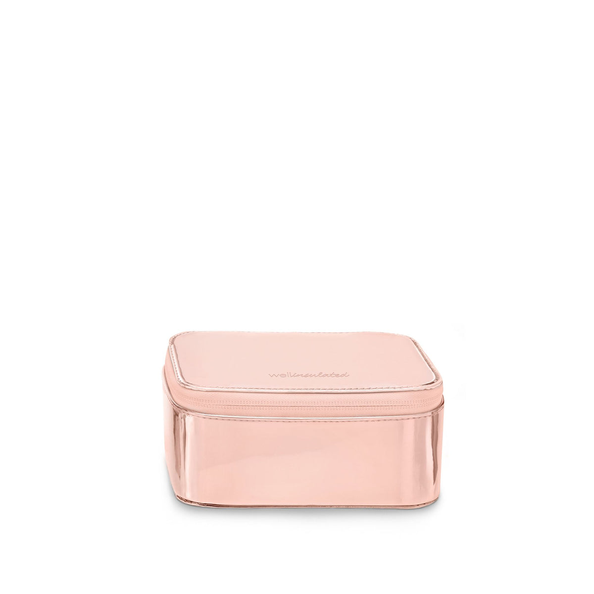 WELLinsulated Performance Mini Travel Case in rose gold, a small structured  insulated case for vitamins, small electronics, and jewelry.